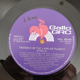 Stimela – Trouble In The Land Of The Plenty - Vinyl LP Record - Very-Good Quality (VG)  (verry)